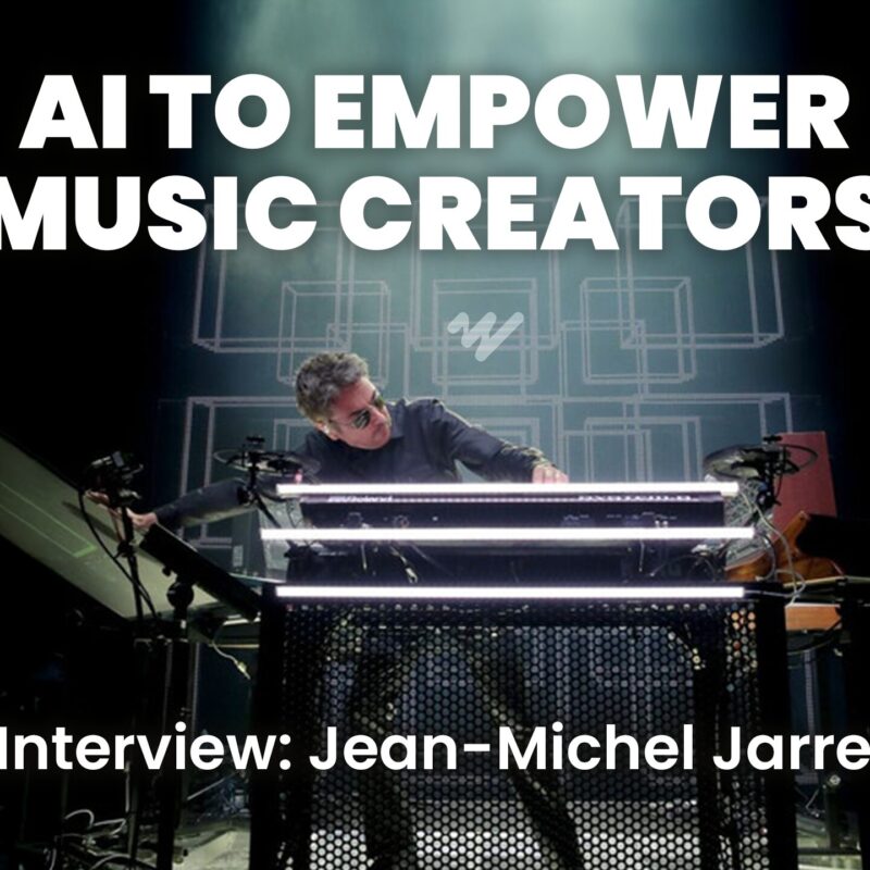 Jean-Michel Jarre performing live with futuristic electronic instruments, discussing AI in music